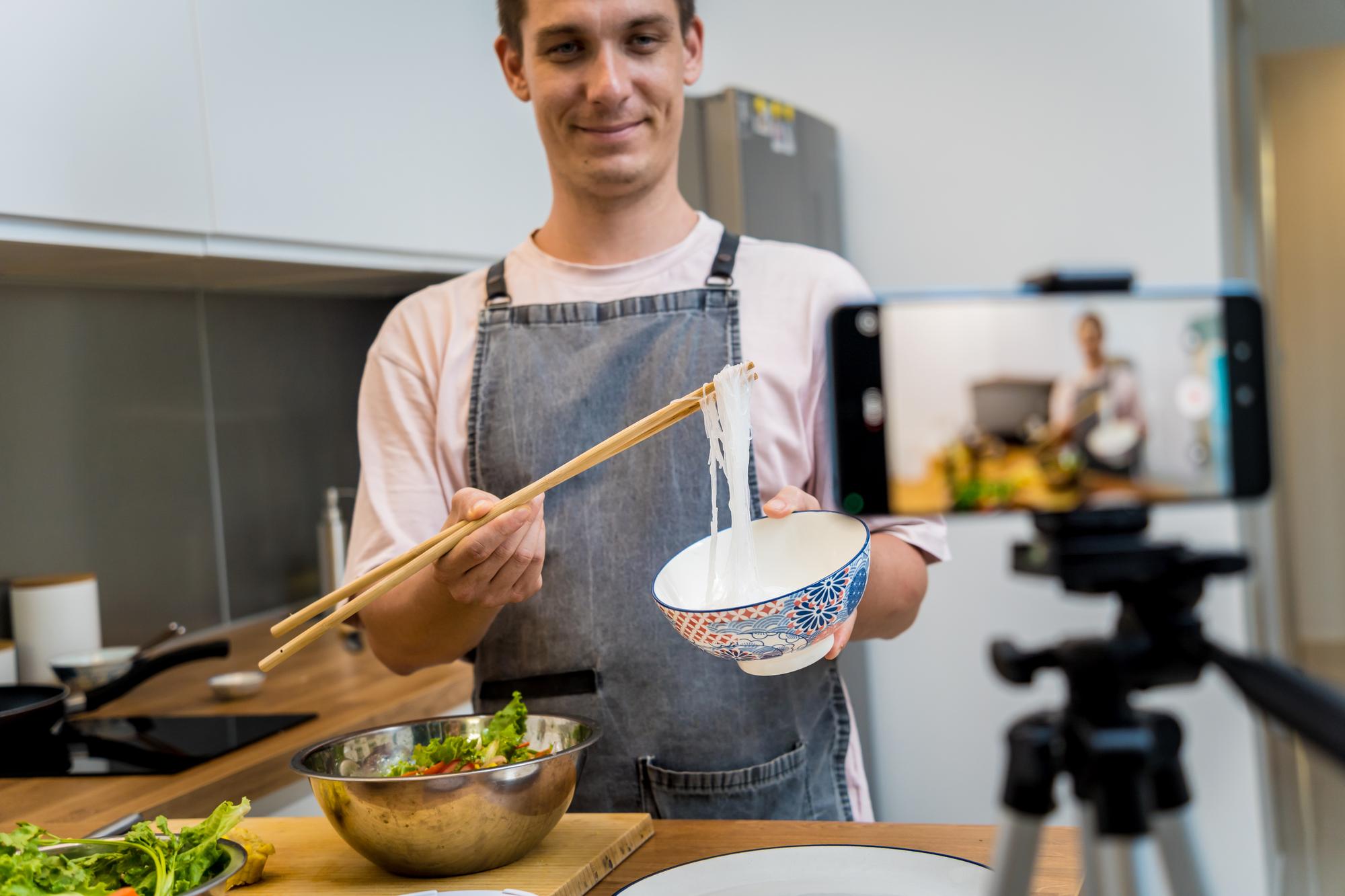 Instructor in a modern kitchen teaching online